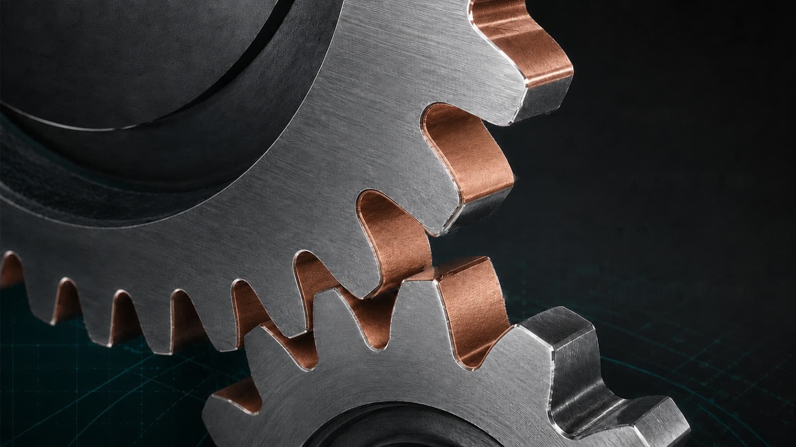 Illustration of meshing gear teeth carrying a copper-rich protective film on the loaded flanks